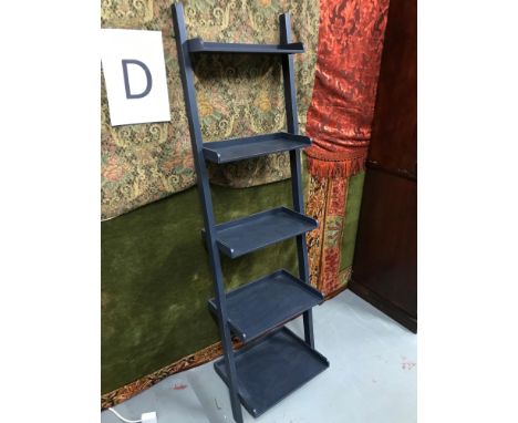 A Contemporary ladder style shelving unit. 
