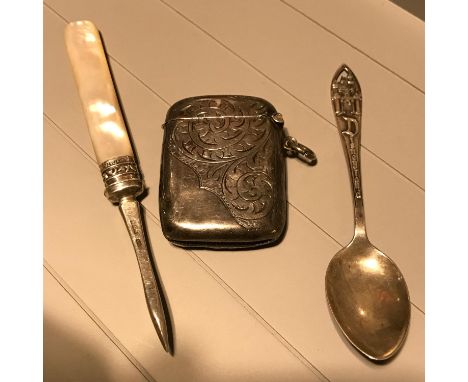 A Birmingham silver vesta case, Sheffield silver and mother of pearl handle manicure item and Sterling silver Disneyland tea 