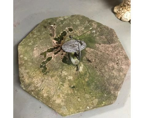 A Large hand carved early 18th century stone sun dial/ compass, dated 1712. Engraved with roman numerals. Measures 75cm in di