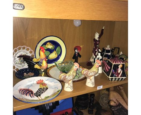 A shelf of collectable porcelain to include teapots, figures &amp; cockerel items 