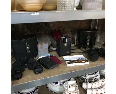 A Shelf of collectable odds to include two pairs of binoculars with carry cases, Kodak camera, Brain trainer, Sinclair item a