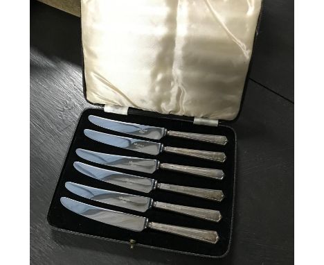 A Set of 6 Sheffield silver handle butter knives with case. 