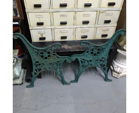 A Pair of ornate Cast Iron garden bench ends. 