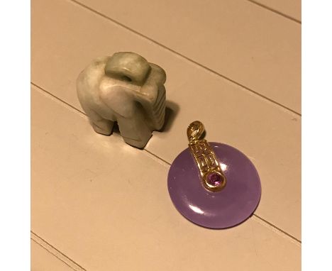 A Purple jade, Amethyst and 10kt gold pendant together with a hand carved jade elephant pendant.