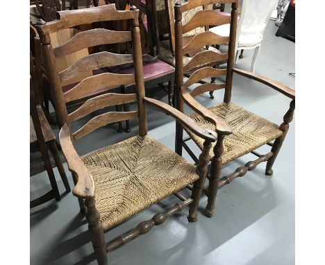 A Lot of two 18th/ 19th century farm house chairs. Designed with ladder backs, arm rests and weaved seat areas. 