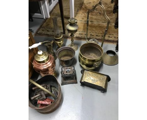 A Collection of antique brass and copper wares to include Two paraffin lamps, Copper coal bucket, Flat Irons, Art Nouveau pla