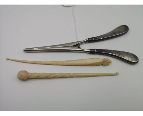 Two Victorian unusual grain carved button hooks, One in the shape of a Narwhal horn together with a Birmingham silver handle 