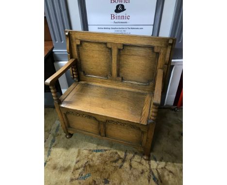 Antique light oak monks settle. Has a lift up seat storage area, Also back support lifts to create a table. Measures 92x92x45