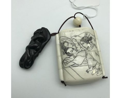 A Japanese bone carved Inro with Japanese hand carved netsuke of a nude lady laying on a squid with black bead eyes and signe