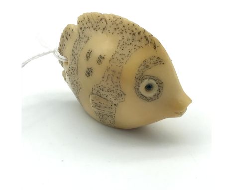 A Highly detailed Japanese hand carved tagua nut netsuke of a fish, Detailed with black bead eyes and signed by the artist.