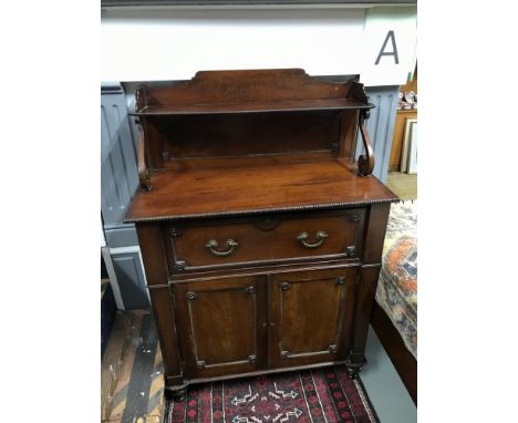 A Regency Secretaire cabinet attributed to Gillows. Has a shelf display top, pull out drawer with fitted drawer interior and 