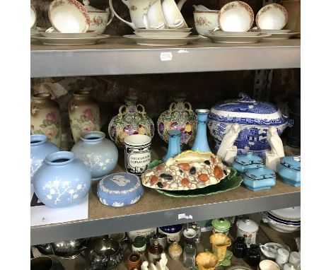 A Shelf of porcelain collectables to include a pair of floral Austrian vases, Wedgwood trinket dish, Sylvac pebble bowl, Art 