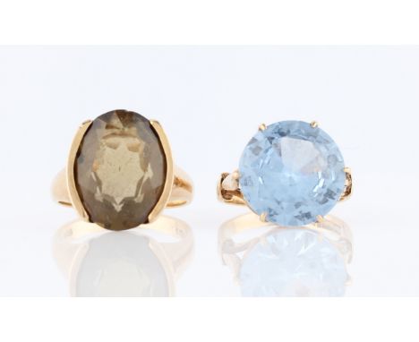 A 9ct yellow gold smoky quartz dress ring, hallmarked London 1968, ring size L, together with a 9ct yellow gold blue paste dr