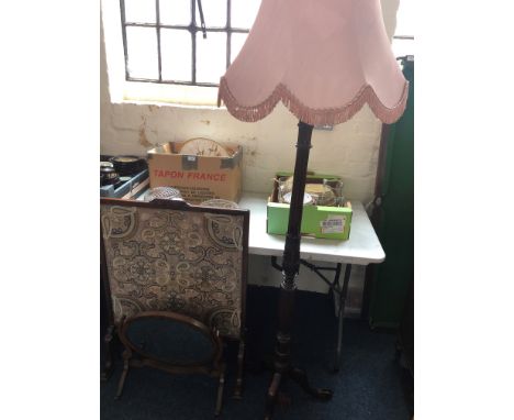 A mahogany turned and fluted standing lamp on tri-form base with shade, embroidered fire screen and one mahogany swing mirror