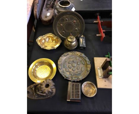 A selection of brassware to include monkey candle stick, Buddha decorated brass tray, a British empire 1924 tea caddy, two sm