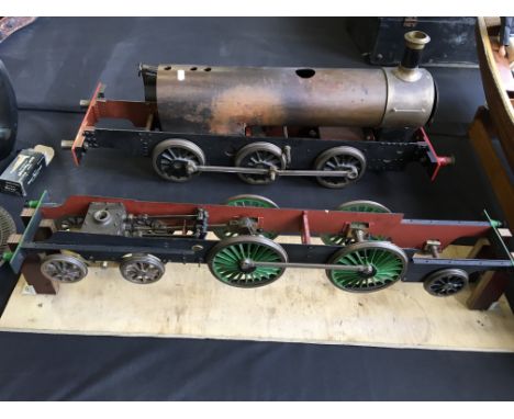 A quantity of model live steam engine parts to include four boxes of parts, one part built train with boiler and one wheel sy