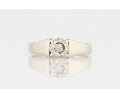A diamond solitaire ring, set with a round brilliant cut diamond approx. 0.73ct, stamped PLAT, ring size M, with accompanying