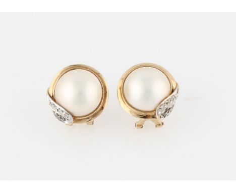 A pair of mabe pearl stud earrings, set with diamond accents, stamped 9ct, width approx. 17mm.
