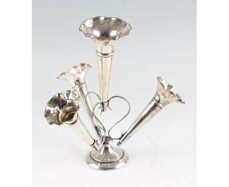 An early 20th Century silver epergne, with central larger trumpet and three smaller trumpets, raised on circular base, hallma