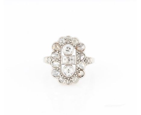 An early 20th Century diamond dress ring, set with Old European cut, rose cut and baguette cut diamonds, stamped 18 & PT, rin