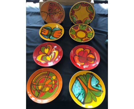 Six Poole wall plates with abstract designs.