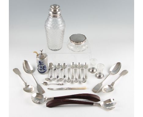 A collection of hallmarked silverware to include a silver topped glass dressing table pot, six teaspoons and a mother of pear