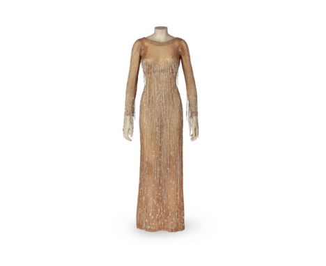 A Mitzi Gaynor 'Let Go' nude illusion gown worn on Mitzi's 2nd Special, designed by Bob MackieNBC, 1969. Nude souffle full-le