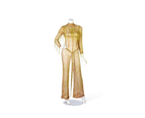 A Mitzi Gaynor nude illusion jumpsuit designed by Bob MackieNude illusion long-sleeved mock-turtleneck jumpsuit made of nude 