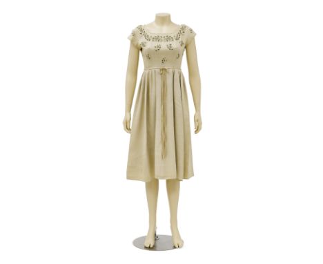 A Paulette Goddard dress from HazardParamount Pictures, 1948. Designed by Bernard Newman. Taupe linen day dress with an embel