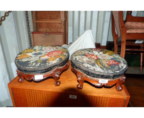 A pair of Victorian stools with tapestry tops.