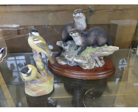 A Border Fine Art otter figure group together with a Royal Worcester figure depicting coal tits 