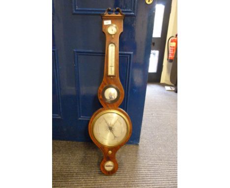 A Georgian mahogany banjo barometer.