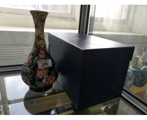 A modern Moorcroft vase with having floral decoration dated 2003 and complete with original box  CONDITION REPORT: First qual