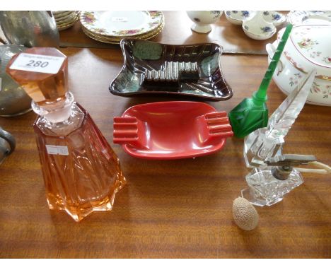 Three assorted glass perfume bottles to include a green coloured example, peach glass decanter etc 