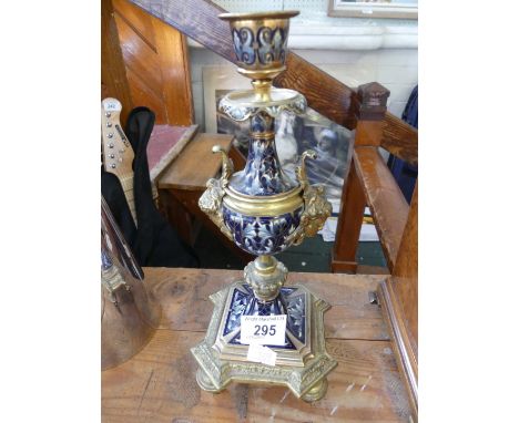 A decorative Victorian style candlestick having brass and enamel decoration 