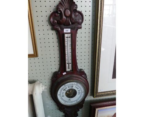 A late Victorian stained oak wheel barometer.