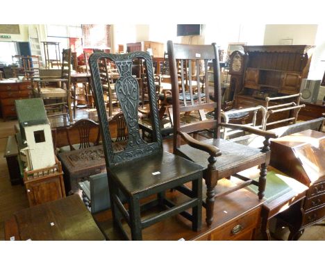 A mid Victorian beechwood country armchair, with bar back cresting rail and splats, with low arms, raised on turned wood supp
