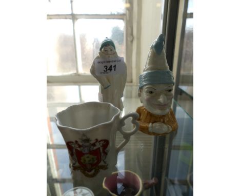 Two Royal Worcester candle snuffers to include Punch and Toddie together with a Crested ware miniature cup 