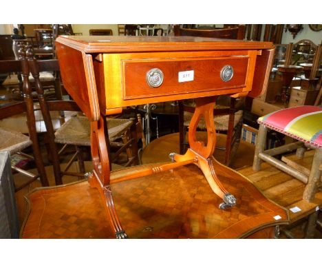 A reproduction sofa table of small proportions.