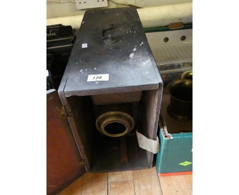 A Vintage magic lantern contained in wooden storage chest.