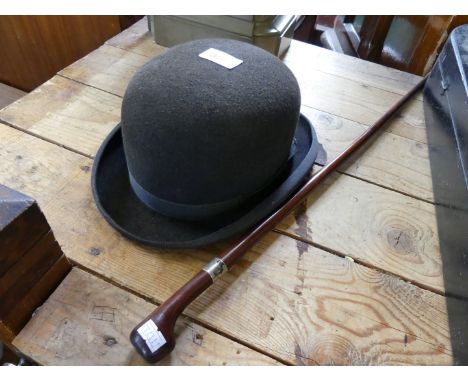 A good quality swagger stick with white metal ferrule together with a vintage bowler hat 