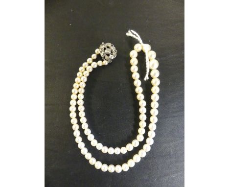A graduated pearl necklace, with a paste clasp CONDITION REPORT: Pearls untested 