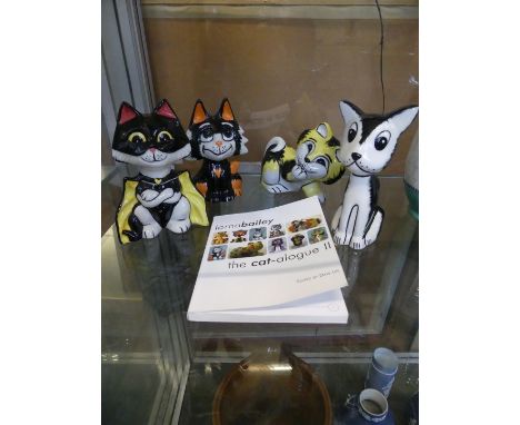 Four Lorna Bailey ceramic models of cats together with a cat catalogue 