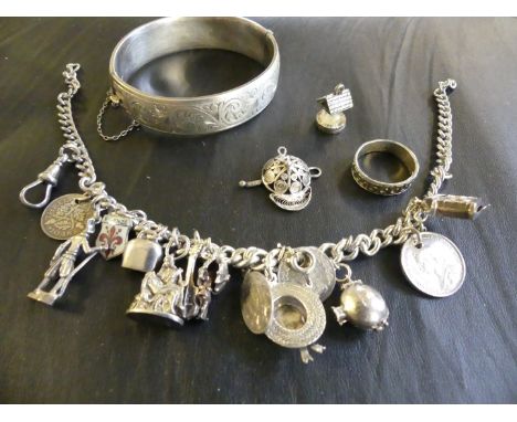 A silver charm bracelet, together with a silver bangle (2)