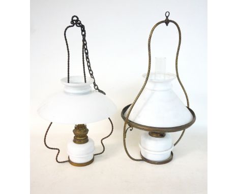SHAPED HANGING OIL LAMP
with a twist design brass frame, an opaque white glass reservoir and shade and clear glass chimney, 5