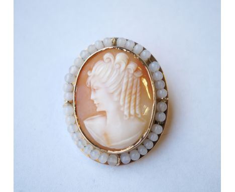 ATTRACTIVE CAMEO BROOCH
the central shell cameo depicting a woman in profile in moonstone bead surround, on nine carat gold m