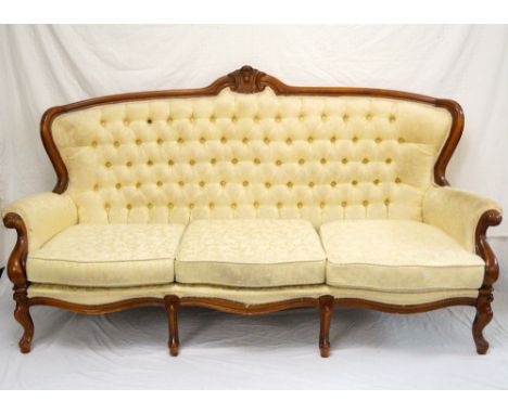 MAHOGANY FRAME THREE SEAT SOFA
with a shaped button back with scroll arms, standing on cabriole front supports, 200cm wide 