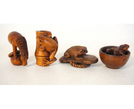 FOUR JAPANESE HARDWOOD CARVED NETSUKE
depicting two rats in a bowl, a horse atop a sphere, a toad on a sandal and a frog on a