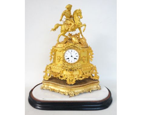 VICTORIAN GILT METAL MANTLE CLOCK
with an eight day French movement, the circular enamel dial marked 'R.Stewart' set in a sha