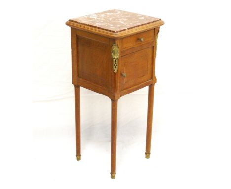 FRENCH OAK BEDSIDE CABINET
the marble top above single drawer and cupboard with ceramic interior, raised on long cylindrical 